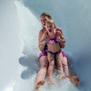 Enjoying the excitement of a super water slide at Adventure Land